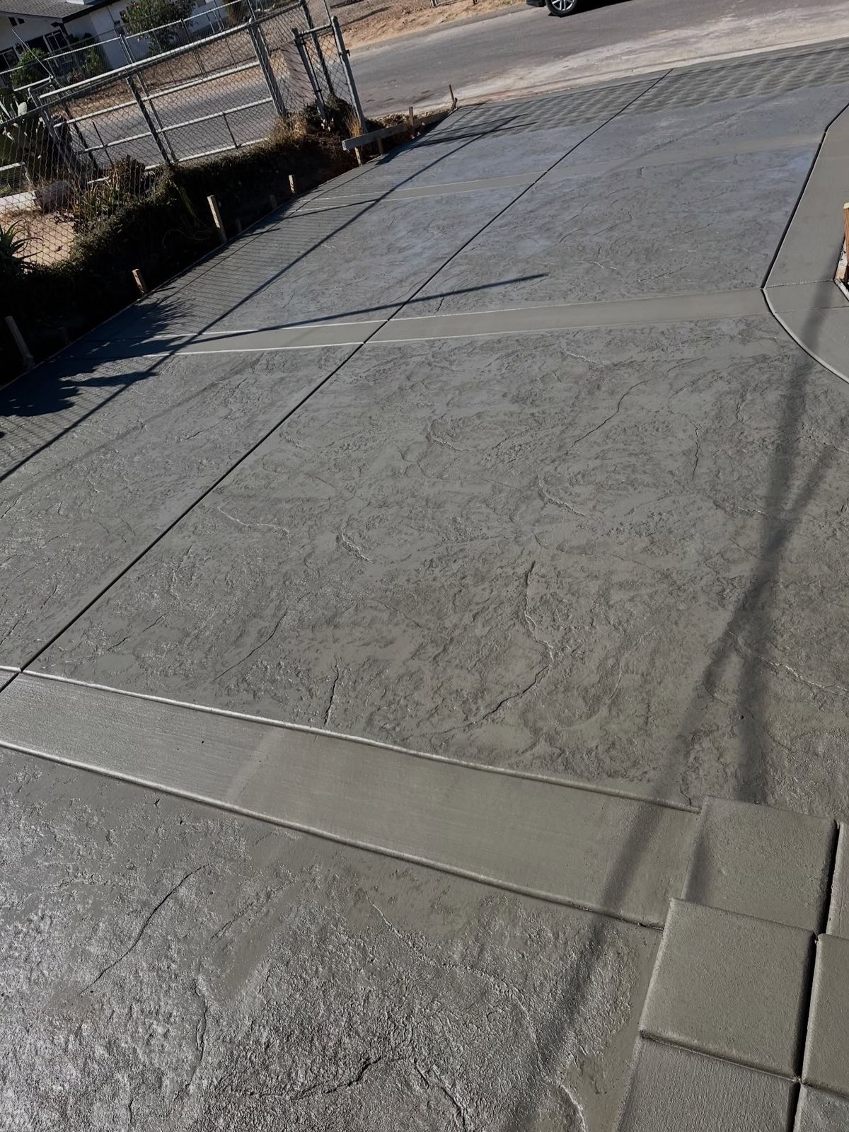 Long jointed concrete driveway with a textured finish