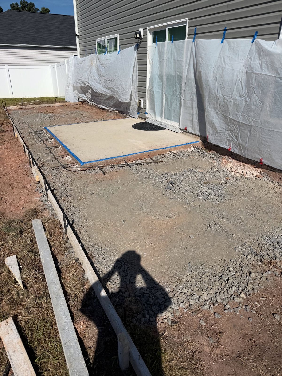 Wood forms staked over a compacted gravel base before the pour